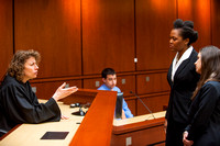 Associate Dean Susan Rozelle acts as judge in a courtroom advocacy scenario.