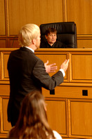 Professor Ellen Podgor plays the role of judge in a courtroom scenario.