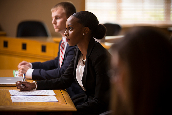 Alumna Darnesha Carter and Evan Dix prepare for a moot court presentation in the FR Courtroom.